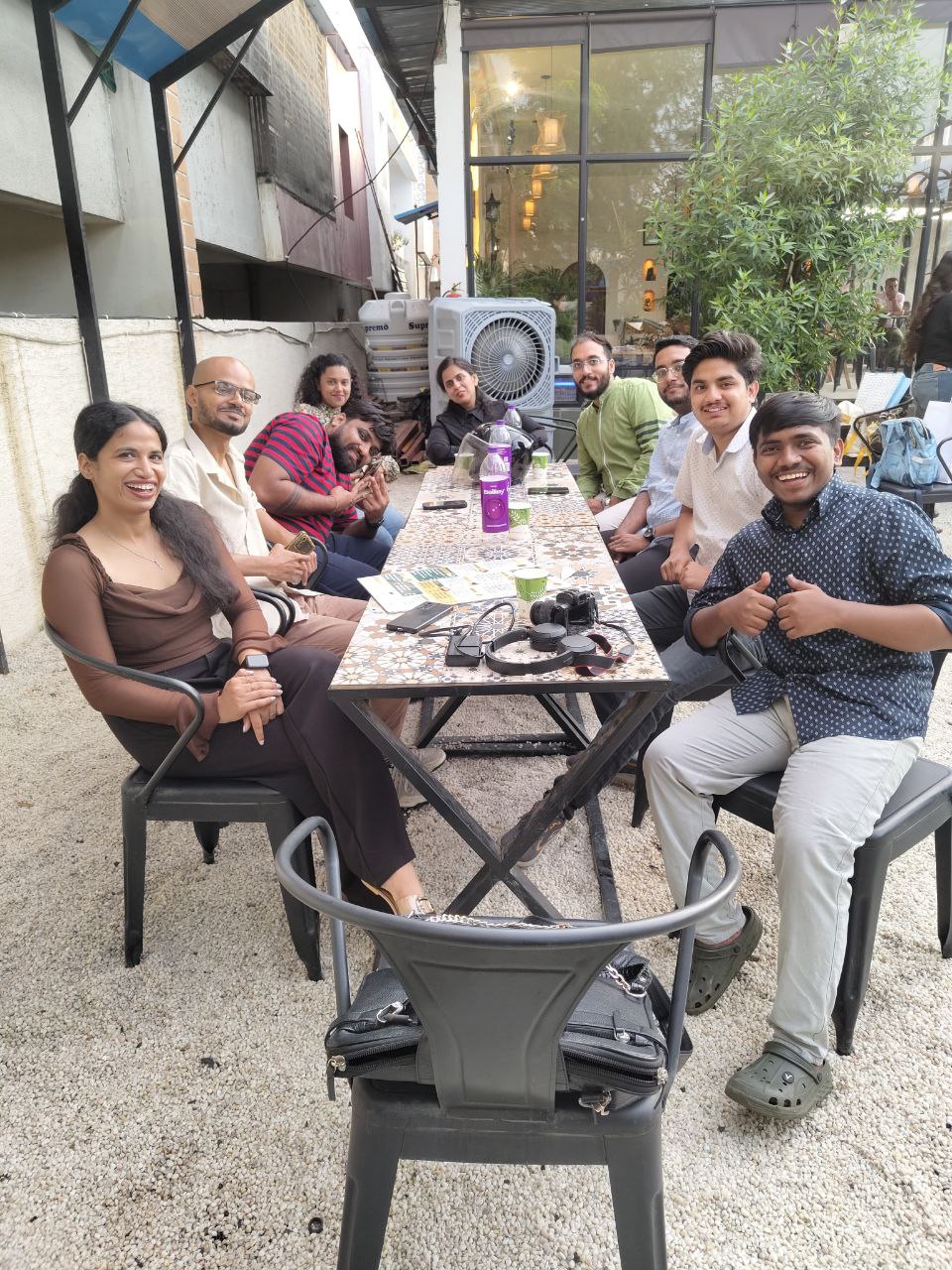 Deepak with a group of friends at a cafe