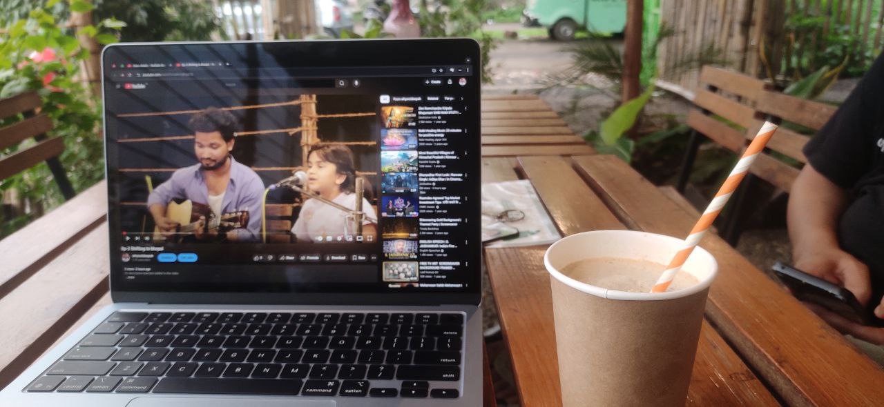 Working from a cafe with a laptop and coffee